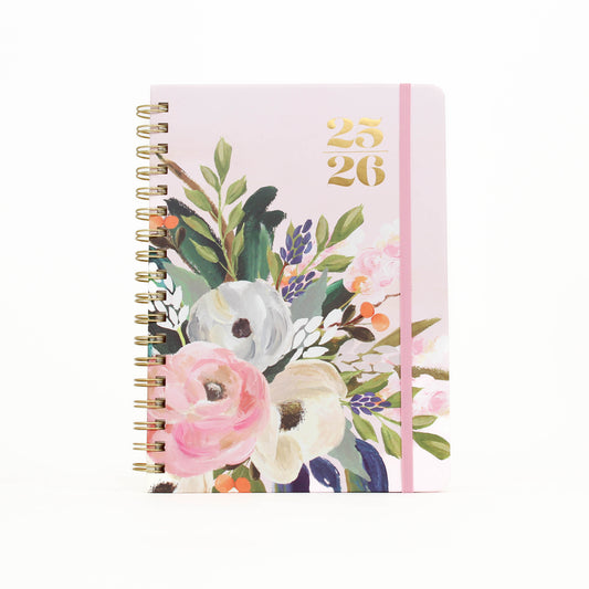 Floral notebook with a pink cover on a white background