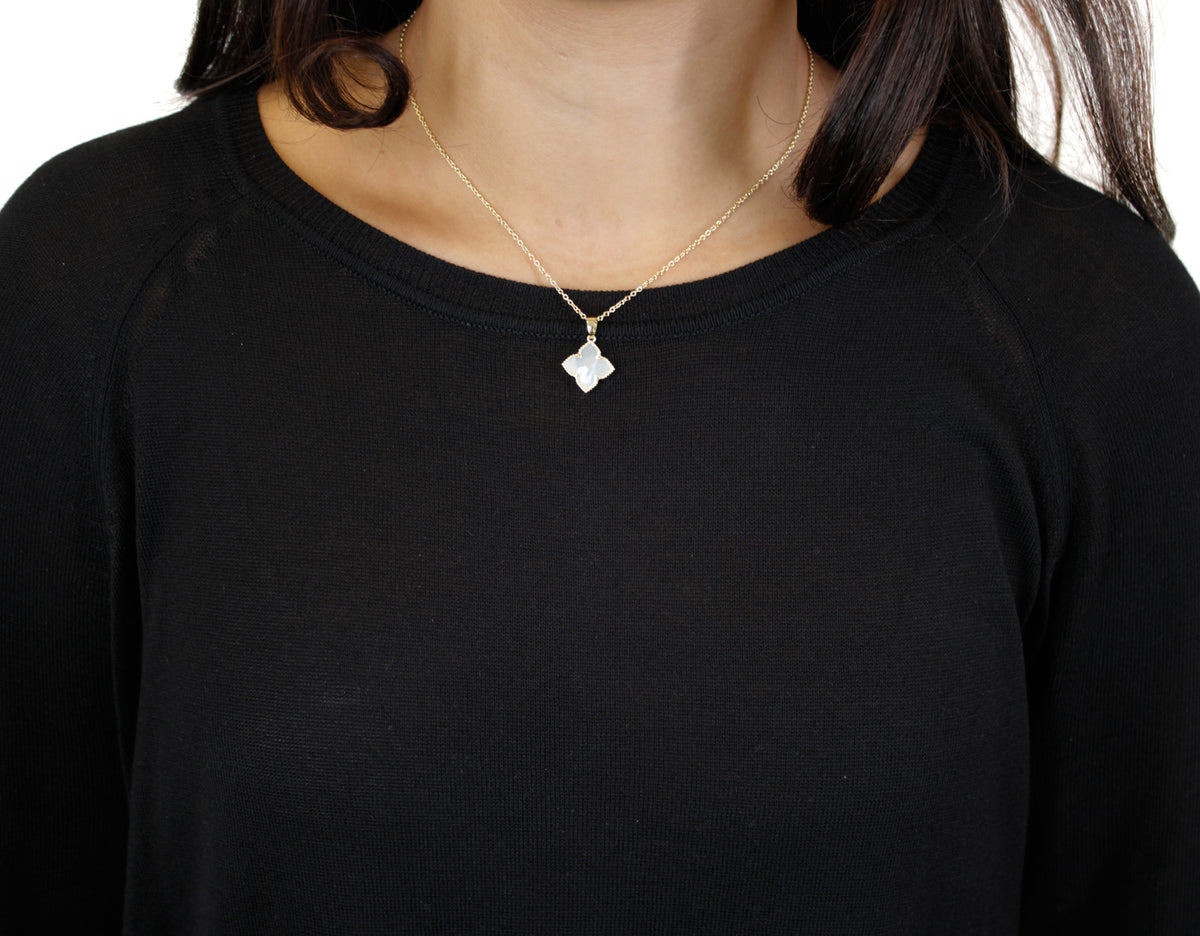 gold chain necklace with pearl flower pendant on model