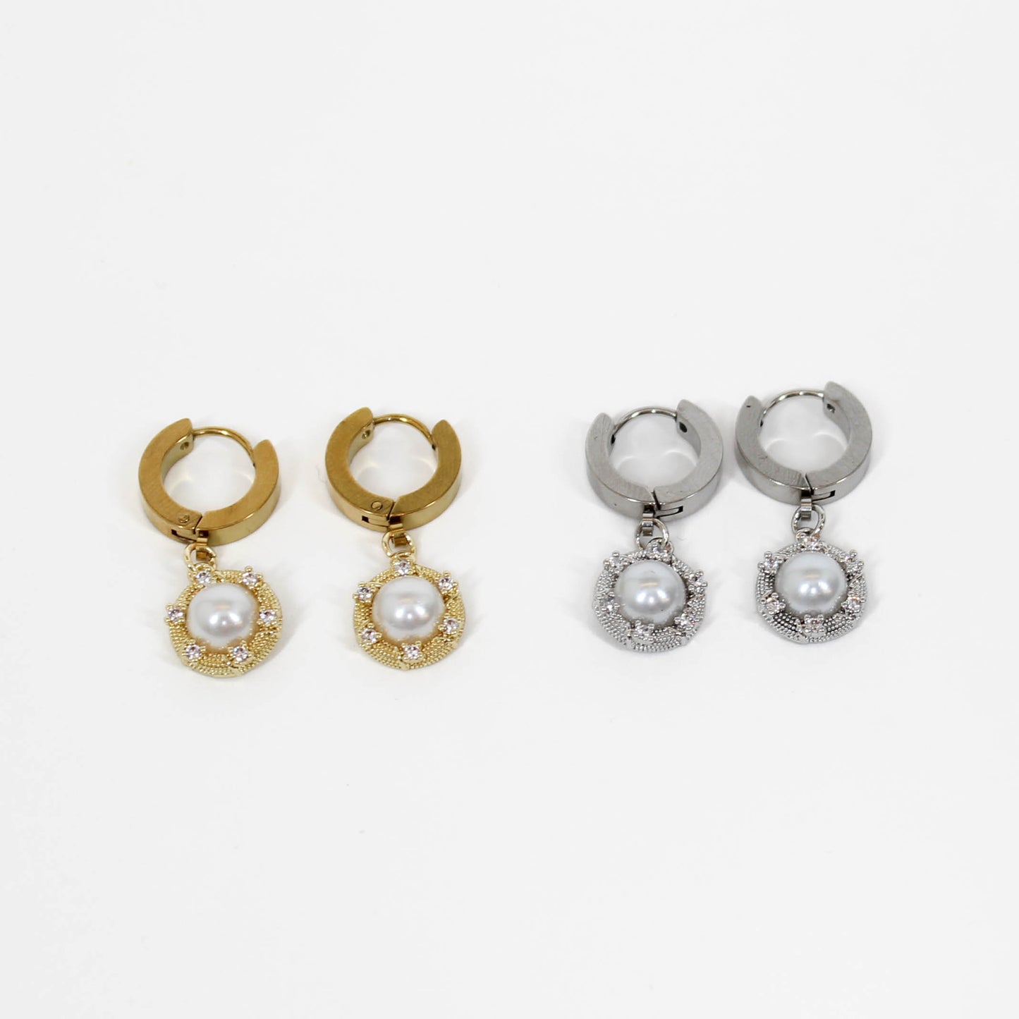 Silver and gold halo pearl drop earrings on white background
