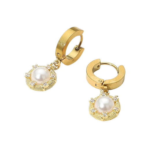 Gold hoop earrings with pearl and gemstone charms on a white background