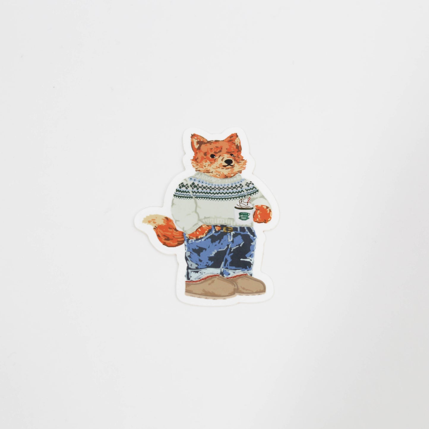 Frankie in a sweater holding hot cocoa 