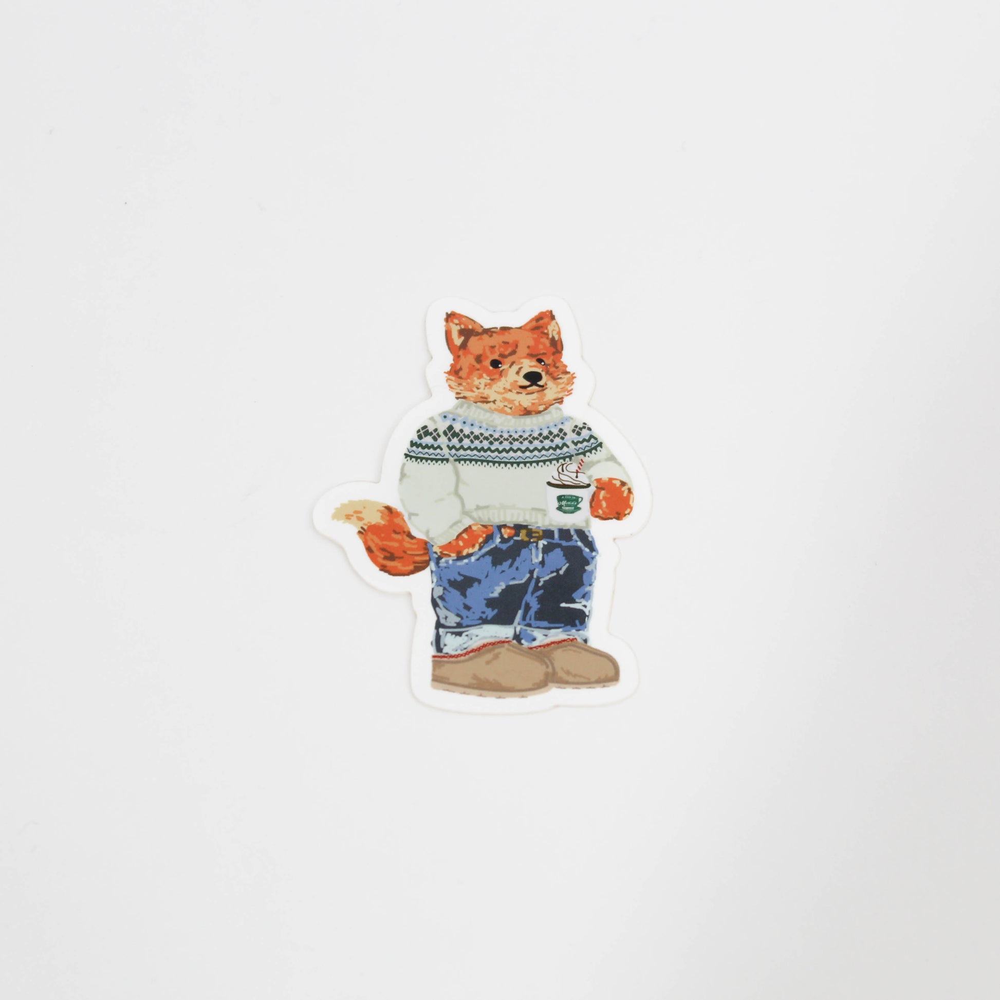 Frankie in a sweater holding hot cocoa 