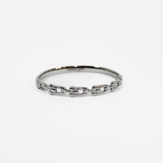 Silver chain industrial link hinged bangle bracelet on a white background