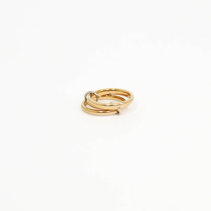 Gold interlocking link ring on a white background