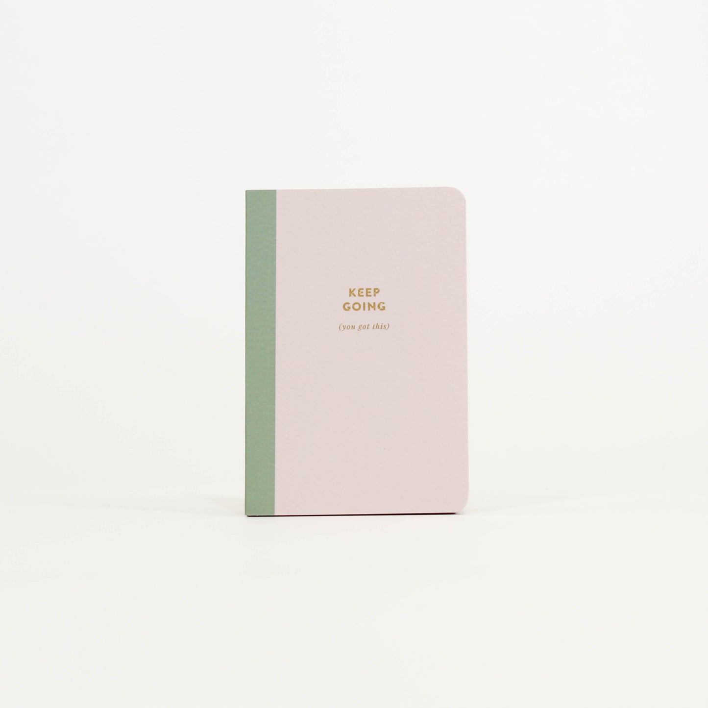 Notebook with 'Keep Going' text 