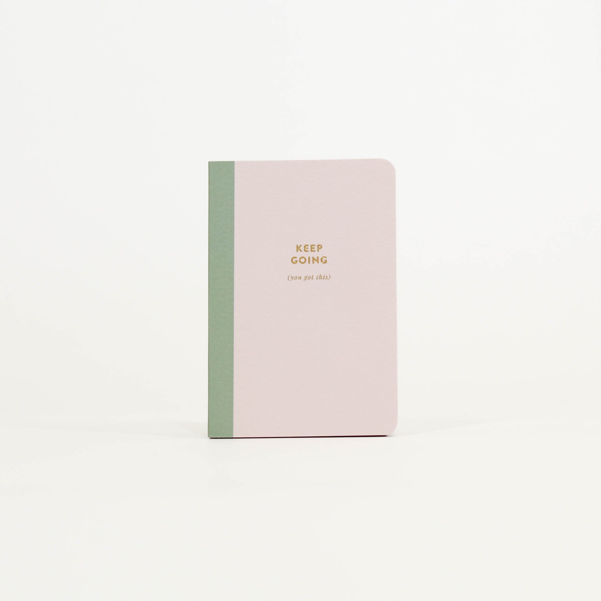 Notebook with 'Keep Going' text 
