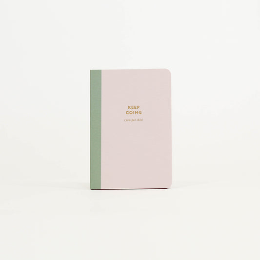 Notebook with 'Keep Going' text 