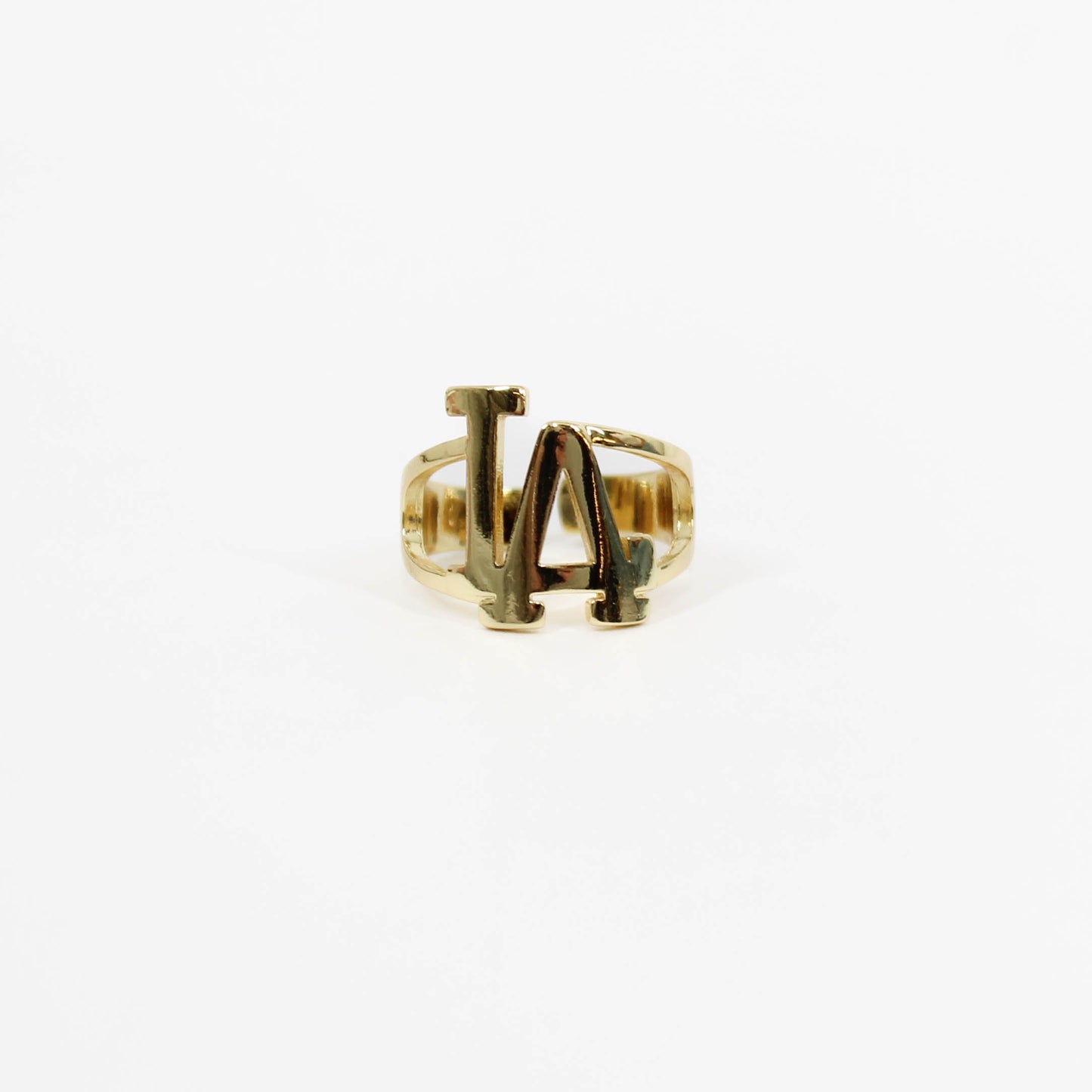 Gold ring with 'LA' initials on a white background