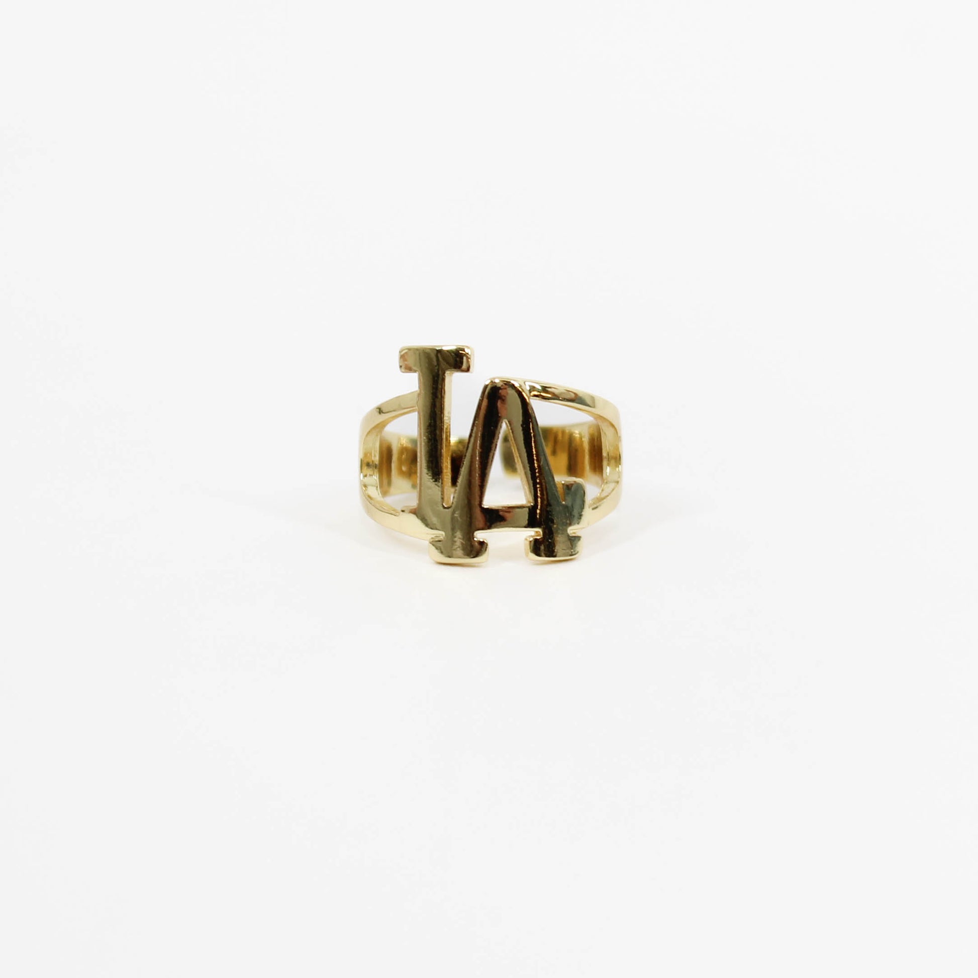 Gold ring with 'LA' initials on a white background
