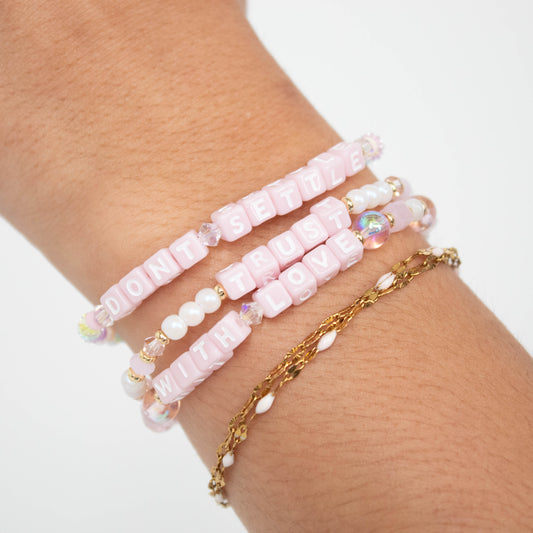 pink letter bracelets