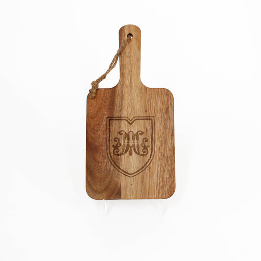 Wooden paddle cutting board with marist shield emblem
