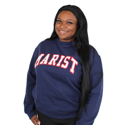 Person wearing a navy blue 'MARIST' sweatshirt on a white background