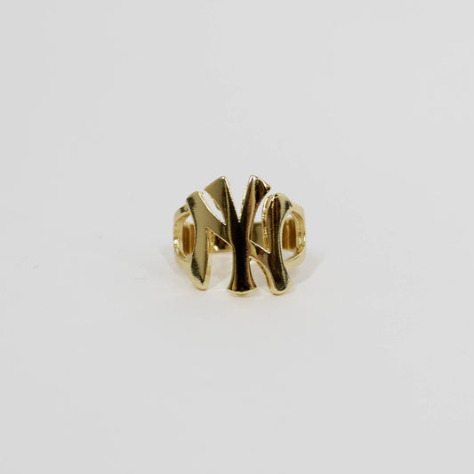 Gold ring with 'NY' design on  white background
