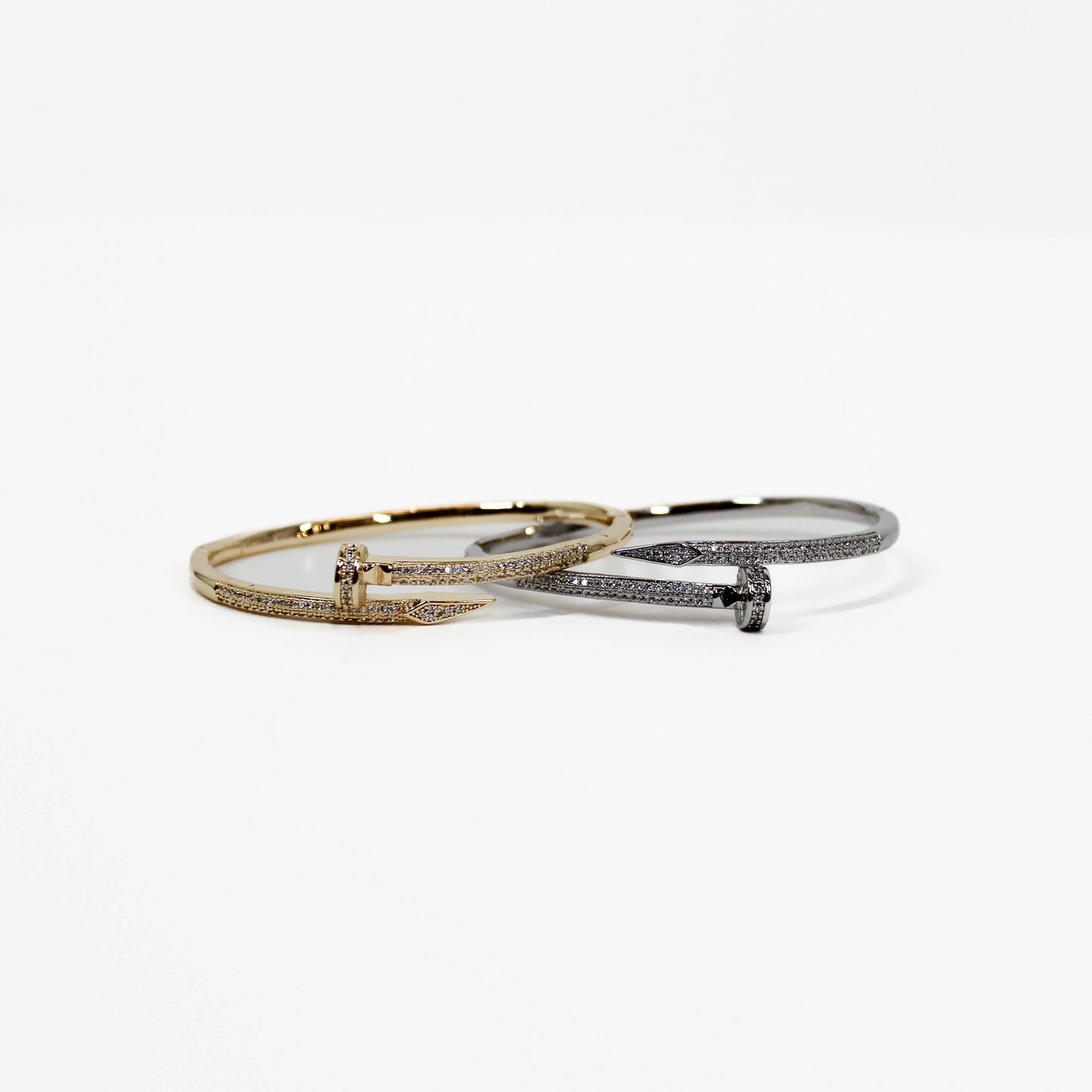 Two nails bangle bracelets in silver and gold