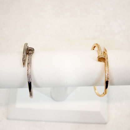Nail Bangle Bracelet gold and silver on display