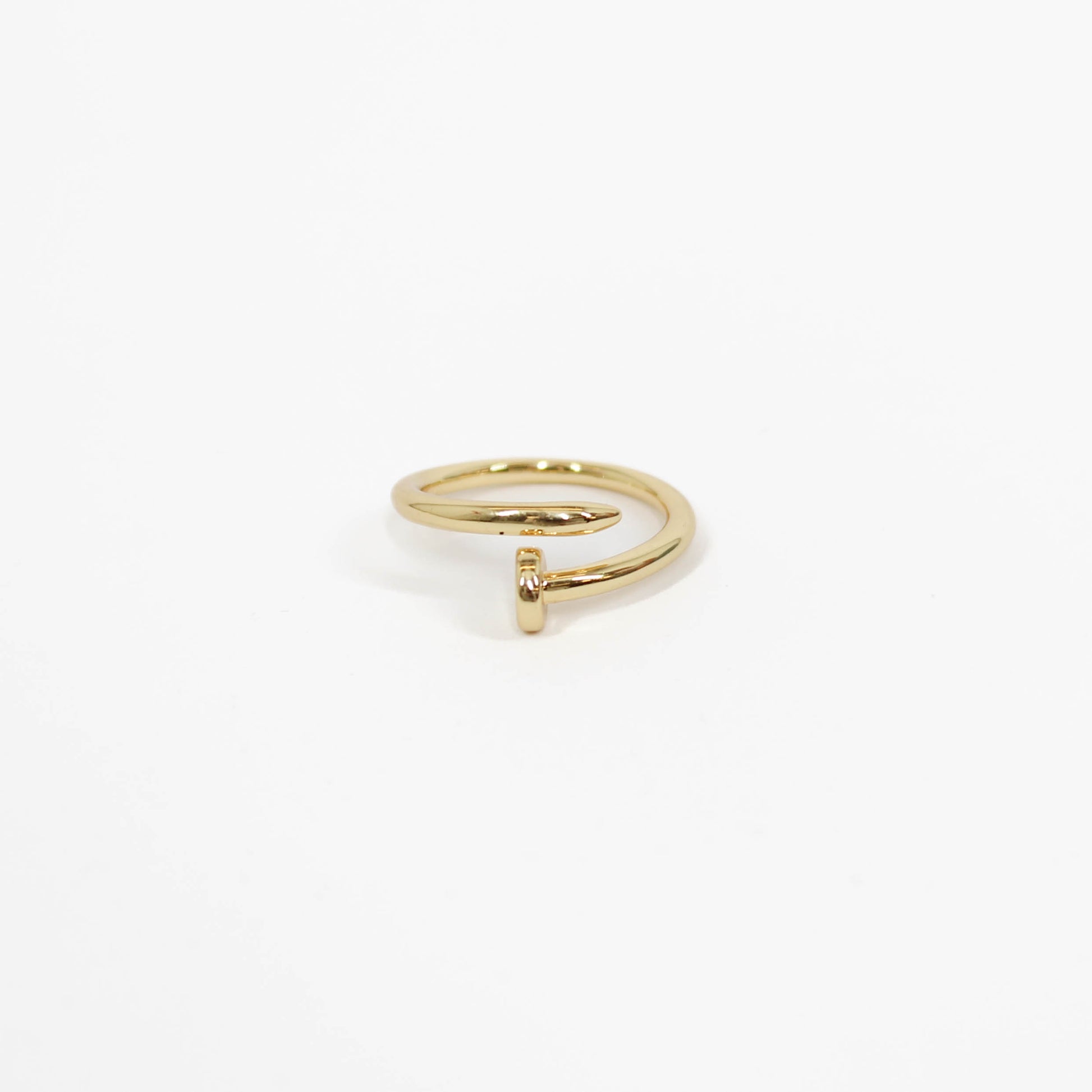 gold nail ring on a white background 