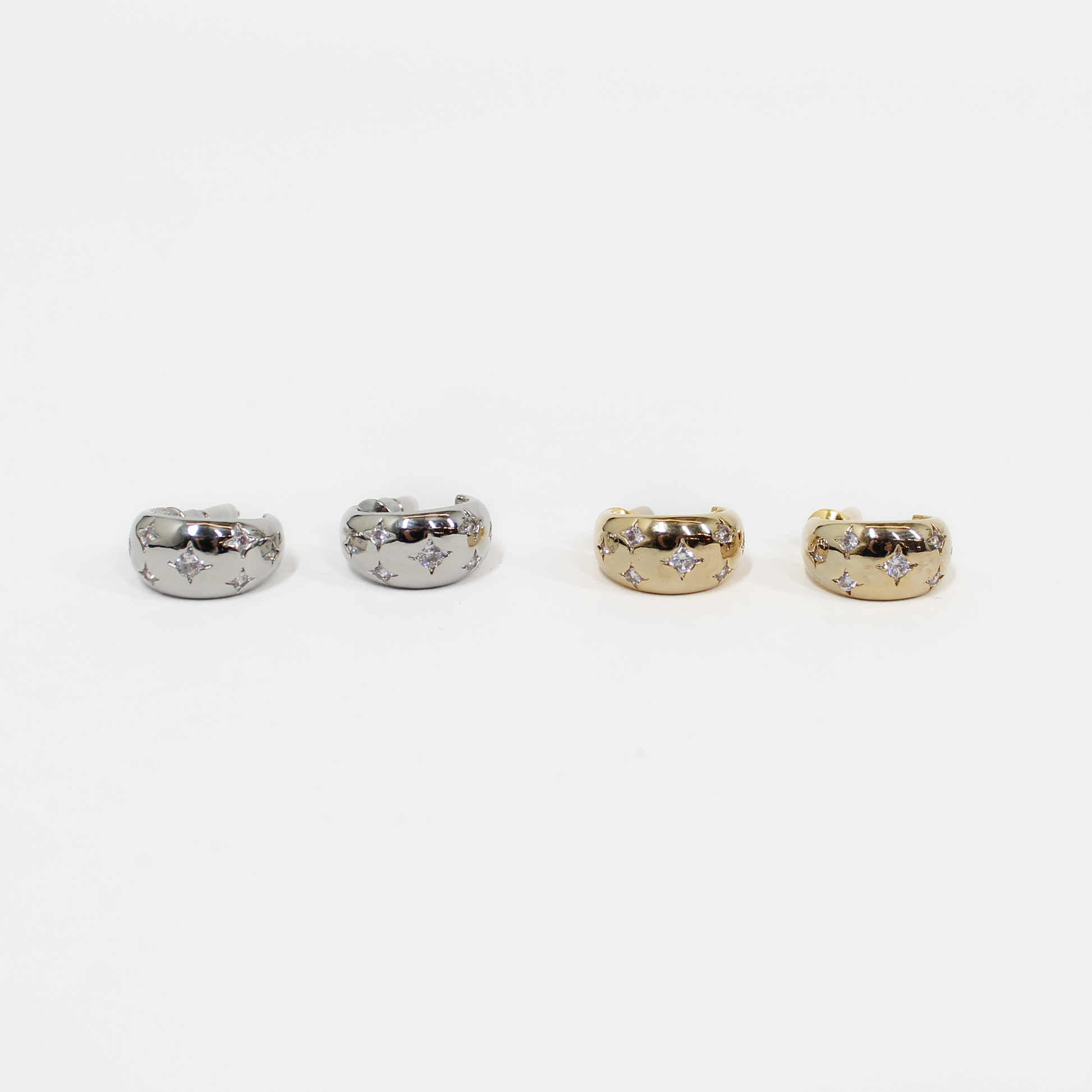 Northern Stars Hoop earrings in silver and gold on a white background