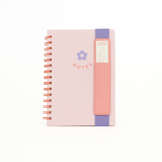 Pink notebook with a colorful strap 