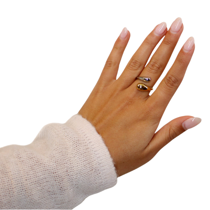 gold and silver twist ring on hand model