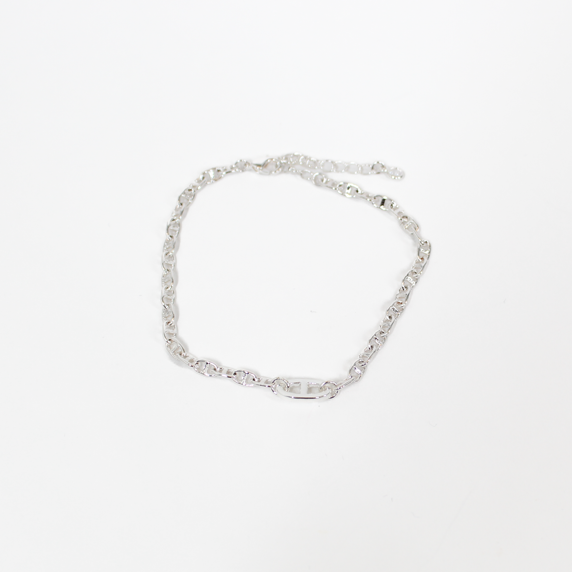Silver oval link chain bracelet on a white background