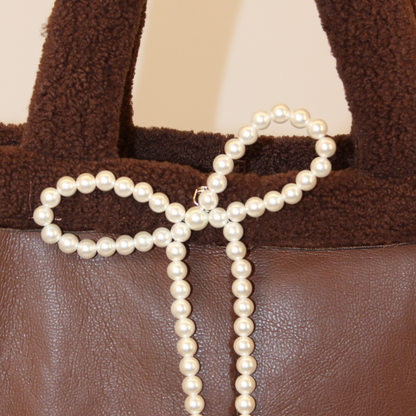 Pearl keychain on bag