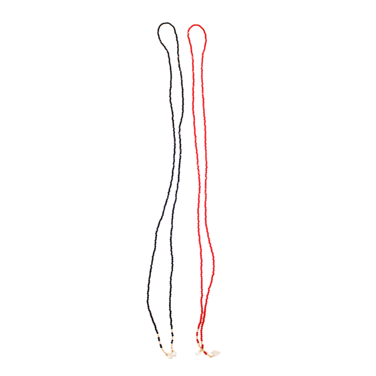 Red and black wrap bead necklaces laying next to each other 