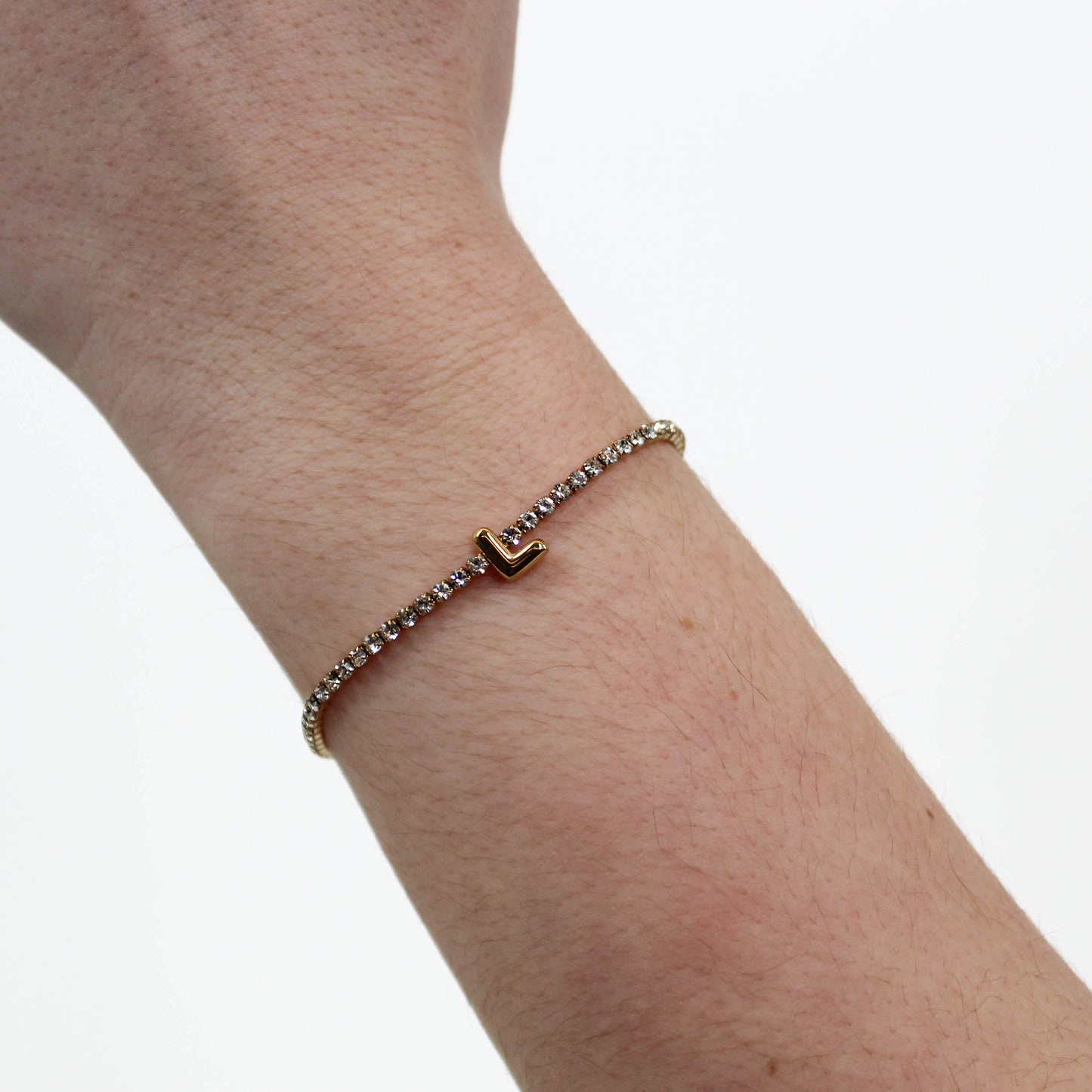 Rhinestone Letter Bracelet L on a wrist with a white background