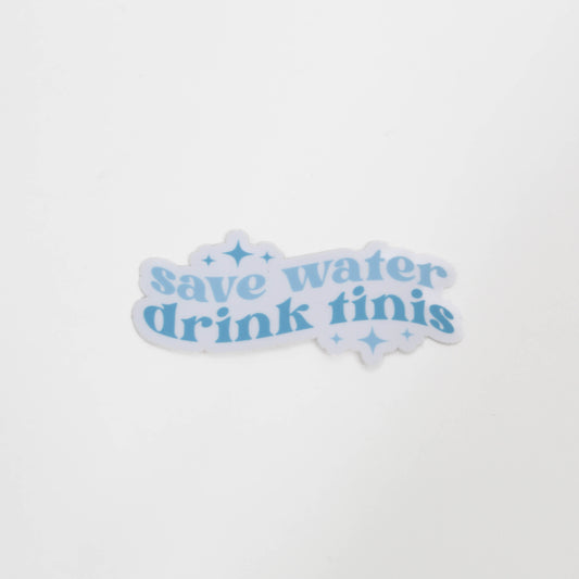 Sticker with 'save water drink tinis' text on a white background