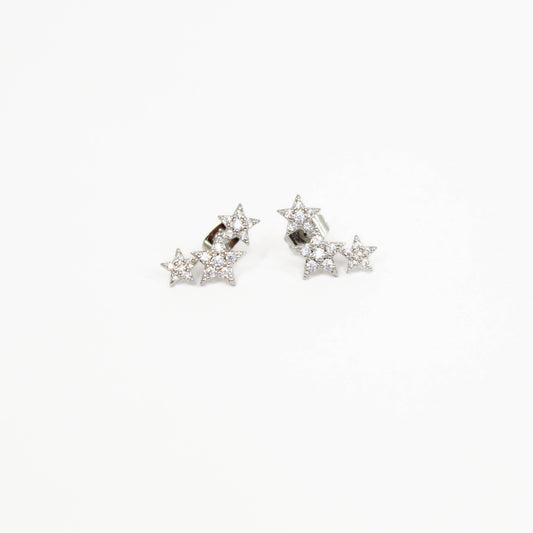 Shooting star-shaped earrings with clear stones on a white background