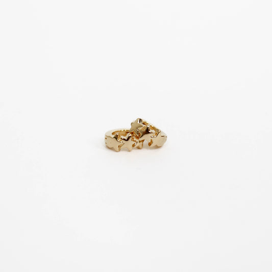 Gold Star huggie earrings on a white background. 