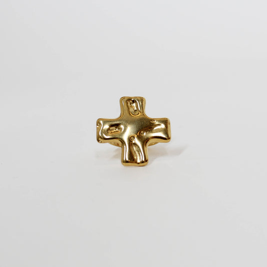 Gold cross ring on a white background