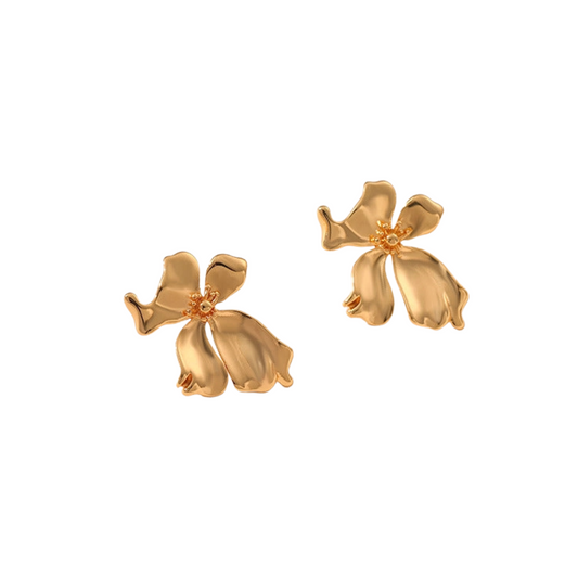 Pair of gold flower-shaped earrings on a white background