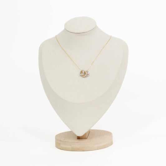 gold Three Ring pendant necklace on a mannequin bust with a white background
