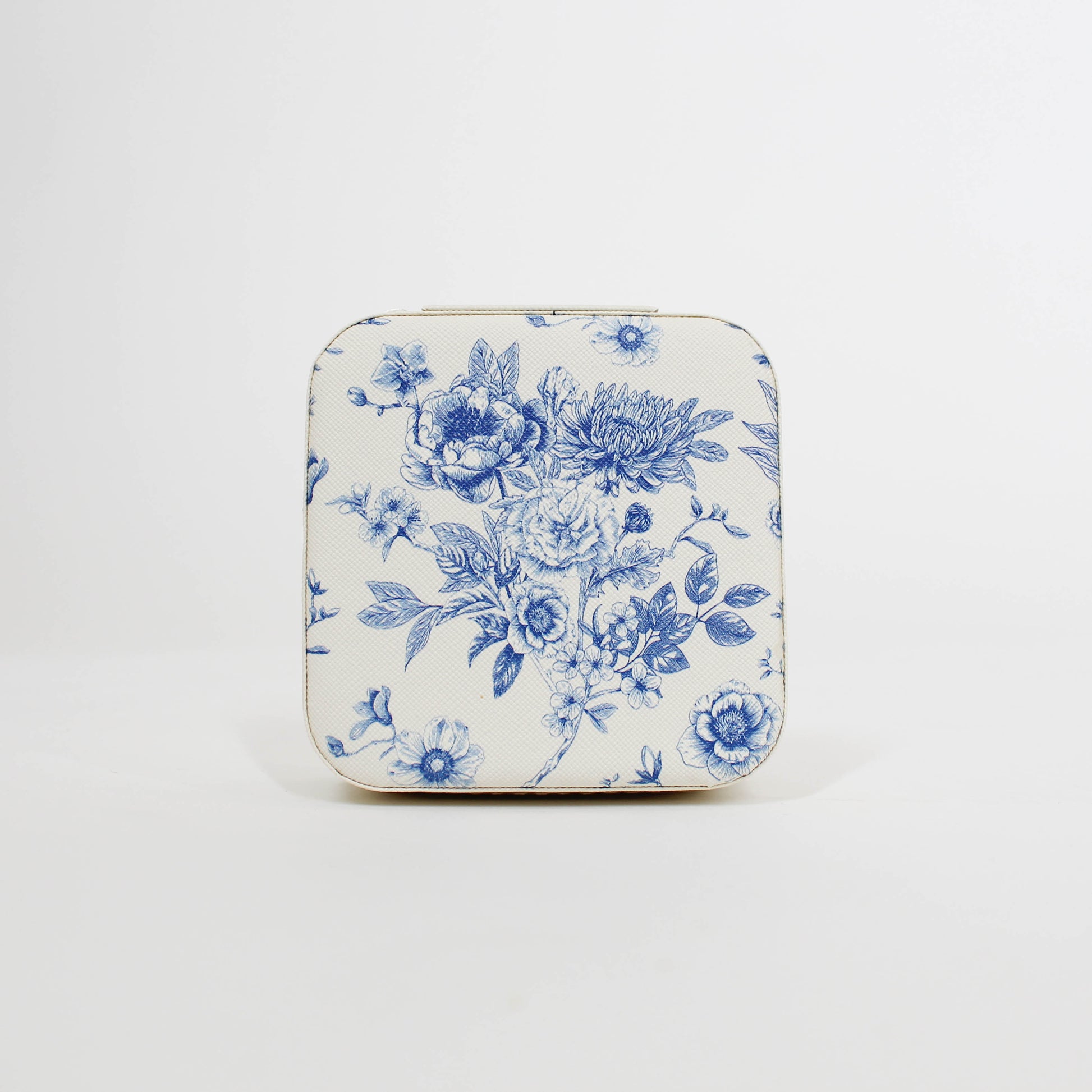 travel jewelry organizer with blue floral pattern on a white background