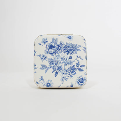 travel jewelry organizer with blue floral pattern on a white background