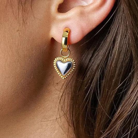 Gold heart-shaped earring with silver accent