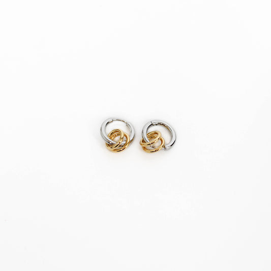 Pair of interlinked two tone link earrings on a white background
