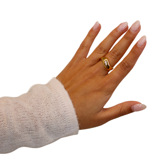 Gold Wavy Band Ring on hand model on white background