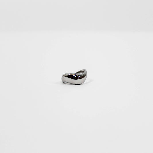 Silver wavy ring on a white background
