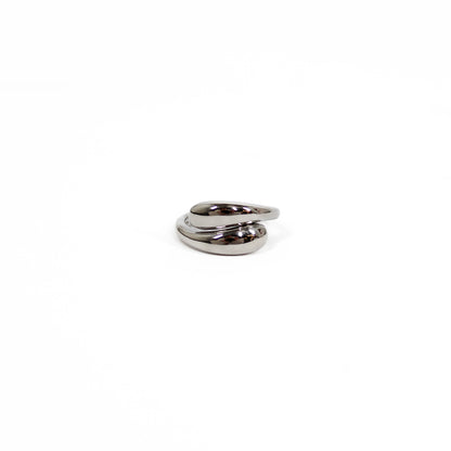 Metallic spiral wrap ring on a white background in silver