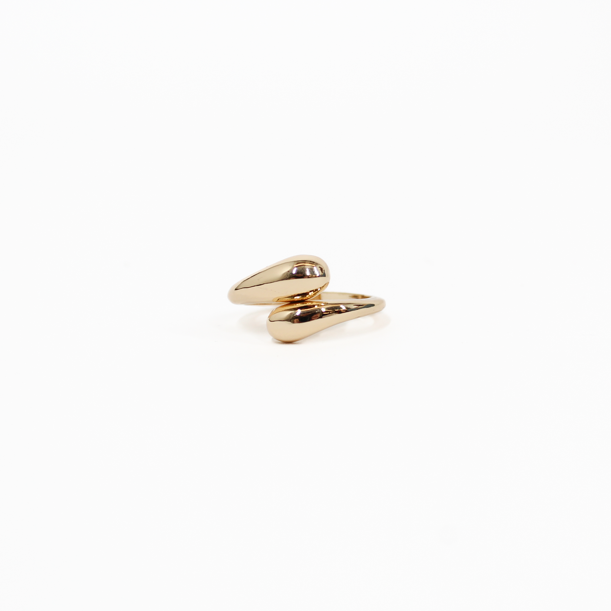 Gold wraparound statement ring on a white background