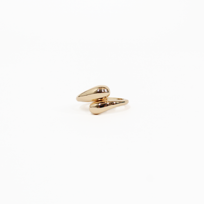 Gold wraparound statement ring on a white background