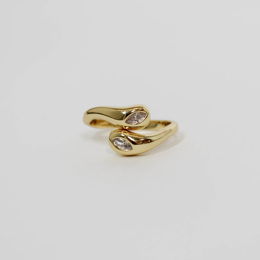 Gold wrapped ring with two embedded CZ stones on a white background