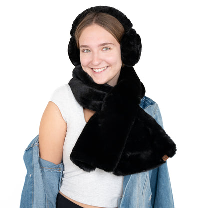 black fuzzy scarf on with matching earmuffs