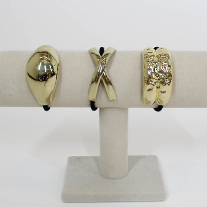 black hair ties with gold details