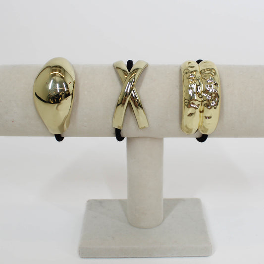 black hair ties with gold details