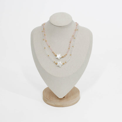 Necklace with star-shaped pendant bubble star choker on a mannequin bust against a white background