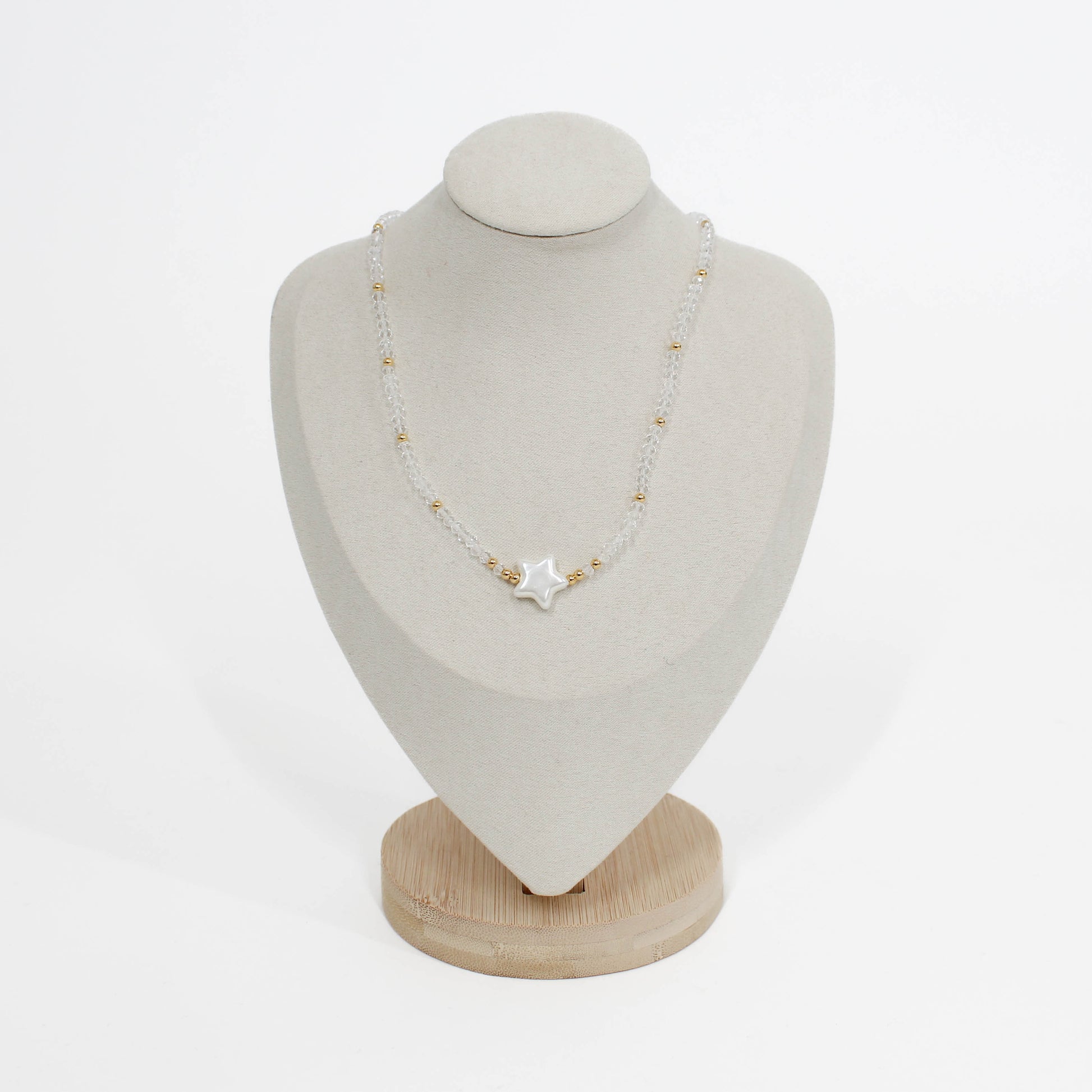 bubble star choker Necklace with a star pendant on a mannequin bust against a white background