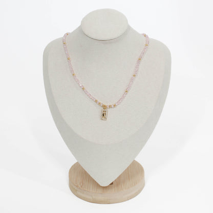 pink moon pave choker Necklace on a white mannequin bust with a plain background