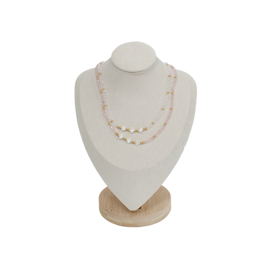 triple clover necklaces on a mannequin bust with a white background